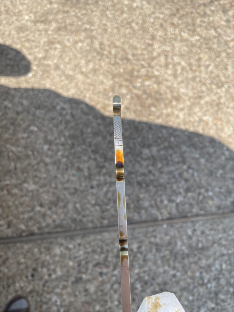 Dipstick Covered in Oil
