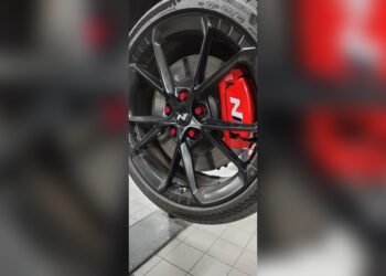 Red Lug Nuts on Black Wheels